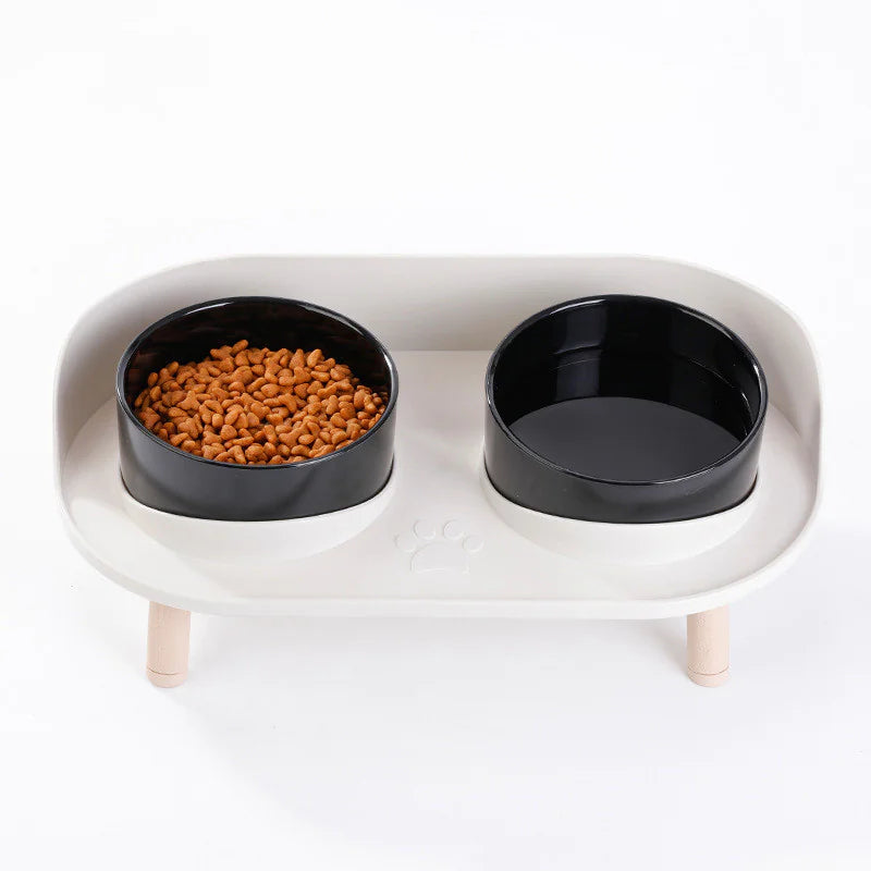 Top view — dark bowl set on raised tray, anti-tip base