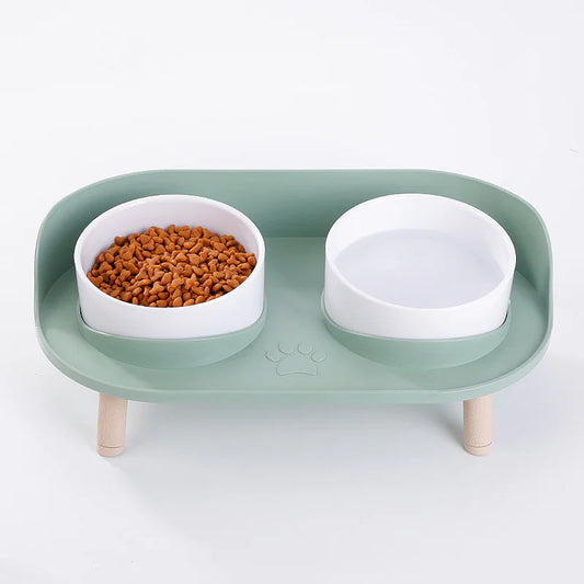 Elevated feeder, 3/4 view — two removable bowls for cats & small dogs, kibble shown.