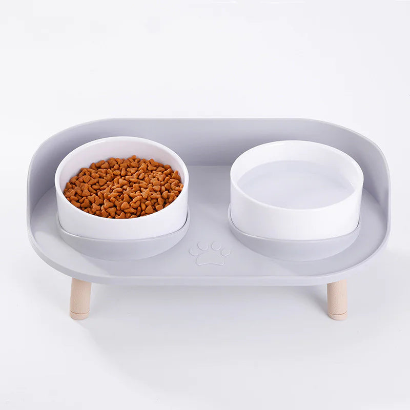 Top view — white bowls on tray; non-slip wooden legs