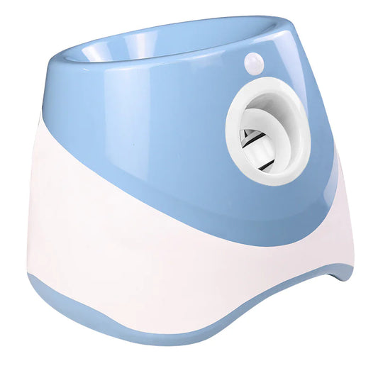 Automatic dog ball launcher, blue/white model—front-left view with hopper and ball outlet.