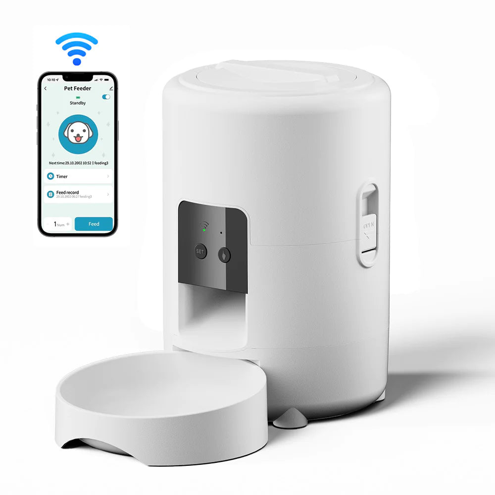 Close-up of white automatic pet feeder showing control buttons and dispensing chute.